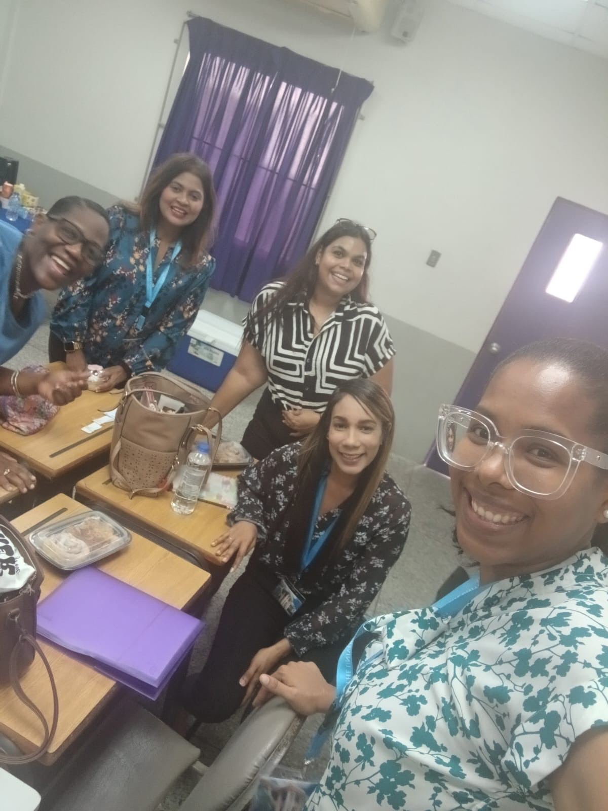 Selfie of six PGDipEd classmates in a classroom
